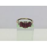 A 9ct gold ring set with three rubies, approx 2.3g