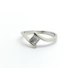 An 18ct white gold ring set with four princess cut diamonds, approx .15ct, apprix 2.5g and approx