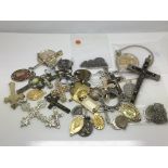 A bag of pendants and crucifixes.