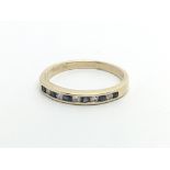 A 9ct gold half eternity ring set with alternating diamonds and sapphires, approx 1.6g and approx