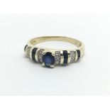 A 14ct gold ring set with alternating sapphires and diamonds, approx 2.8g and approx size O.