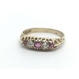 A 9ct gold eing set with three rubies and two diamonds, approx 2g and approx size O.
