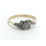 A vintage 18ct gold ring set with nine small diamonds, approx 2.3g and approx size R-S.