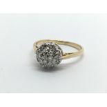 An 18ct white gold diamond cluster ring, approx .1