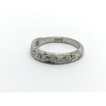 An 18ct white gold ten stone half eternity diamond