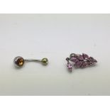 Two body piercing jewellery items, one marked 925.