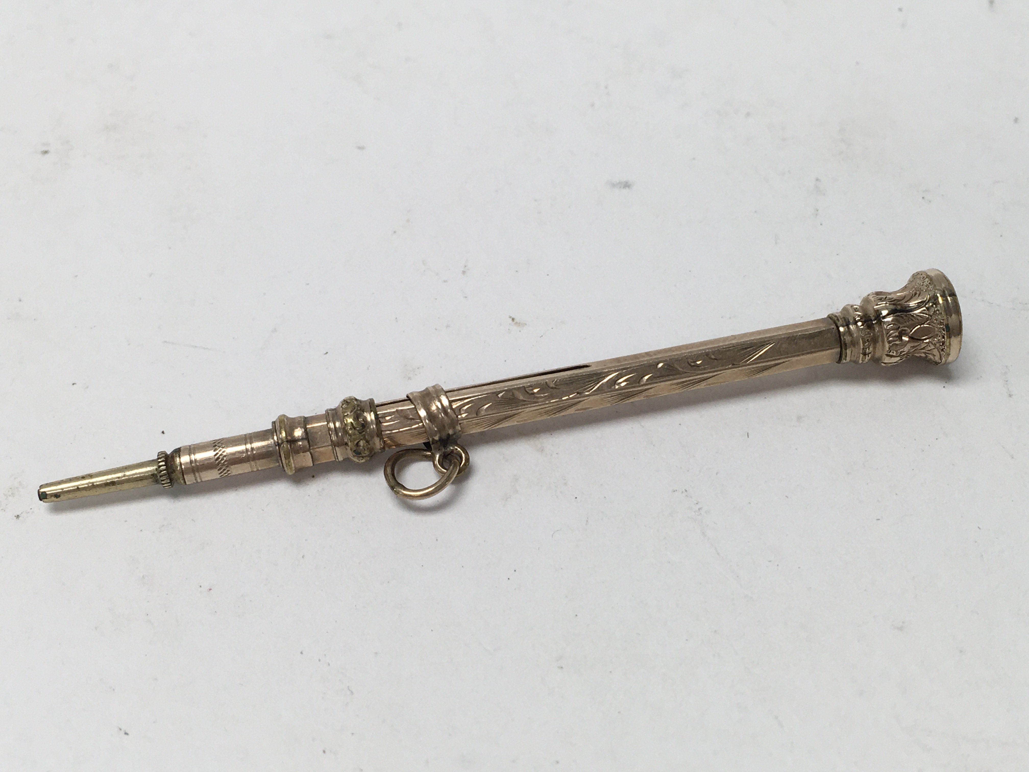 A 9ct gold chatelaine pencil (unmarked).