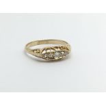 A vintage 18ct gold five stone diamond ring, approx 2.5g and approx size P.