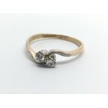 A vintage 18ct gold two stone diamond ring, approx