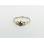 A 14ct gold ruby and diamond ring, approx 1.1g and approx size L.