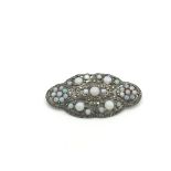 An antique silver and opal brooch.