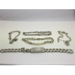 Five silver bracelets comprising two ID bracelets
