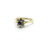 An 18ct gold diamond and sapphire ring, approx 2.8