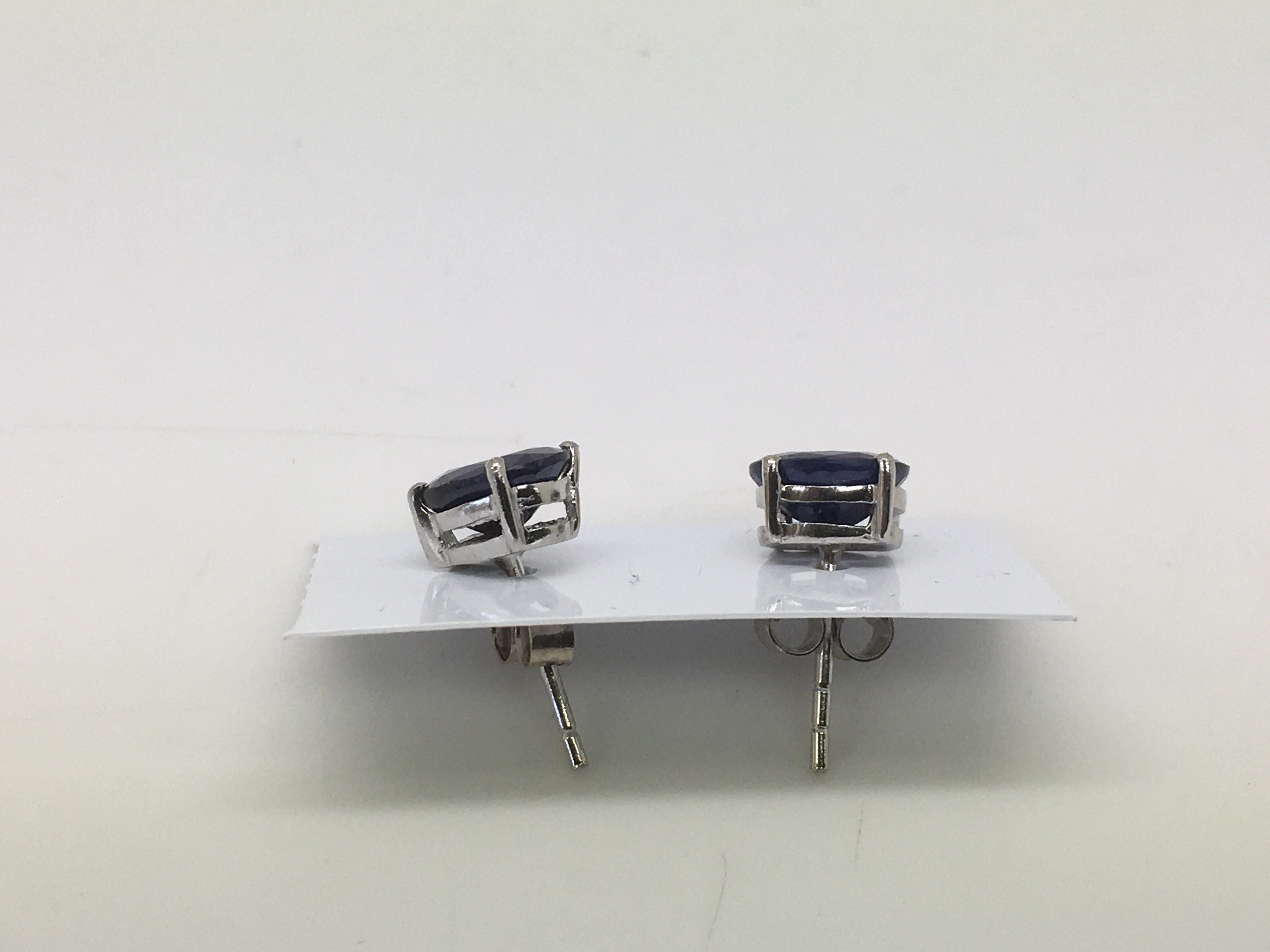 A pair of sapphire ear studs set in silver. - Image 2 of 2