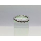 A 9ct white gold half eternity ring set with diamo