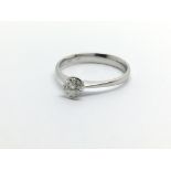 An 18ct white gold solitaire diamond ring, approx