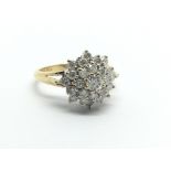 An 18ct gold diamond cluster ring, approx 1ct, approx 4.3g and approx size N.