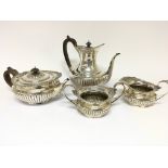 A Quality Silver Harlequin tea set with a tea and