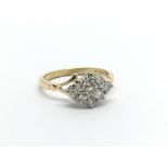 An 18carat gold ring set with a cluster of diamonds ring size K-L