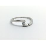 An 18ct white gold solitaire diamond ring, approx