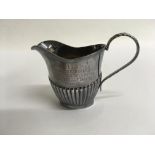 A silver cream jug Sheffield hallmarks 136 grams.