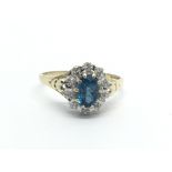 A 9ct gold diamond and topaz set ring. (Y/G)