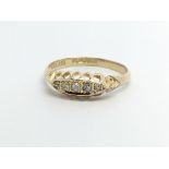 A vintage 18ct gold five stone diamond ring, approx 2.2g and approx size O.