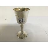 A heavy silver and gilt lined goblet.