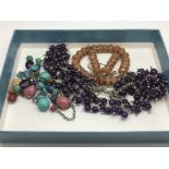Three necklaces comprising cornelian, amethyst and