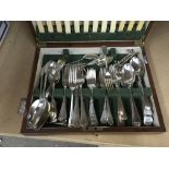 A box of silver plated ware and a canteen of cutle