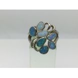 A silver and opal ring, approx size P.