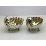 A pair of silver shell cruets, Sheffield hallmarks