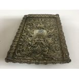 A hallmarked silver embossed card tray with marks