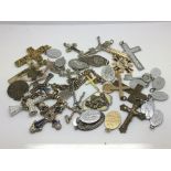 A bag of crucifixes and religious pendants.