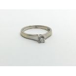 An 18ct white gold solitaire diamond ring, approx 3g and approx size M.