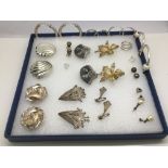 A collection of silver earrings, various designs,