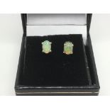 A boxed pair of white Ethiopian opal ear studs set