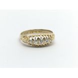 A Vintage 18carat gold ring set with five diamonds Ring size N.