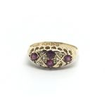 An 18carat gold ring set with four ruby and small chip stone diamonds ring size P-Q