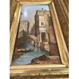 A pair of gilt framed painted porcelain panels depicting Venetian views .12 cm by 26 cm .