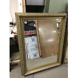 A large ornate gilt framed mirror