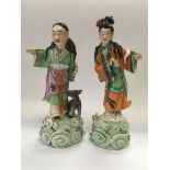 Two Chinese figures painted mainly in green and or