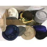 Two boxes containing a collection of various hats