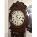 A Victorian mahogany long case clock the circular dial with Roman numerals date and second