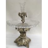 A silver plated epergne with a glass dish centre and single trumpet.