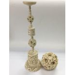 A large carved ivory ball on stand, approx total h