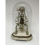 A late 19th century skeleton clock with a silvered