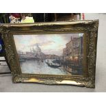 A large gilt framed and glazed print of Venice can