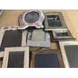 A collection of photo frames including a small frame.