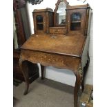 A Victorian walnut inlaid Bureau fitted with mirro